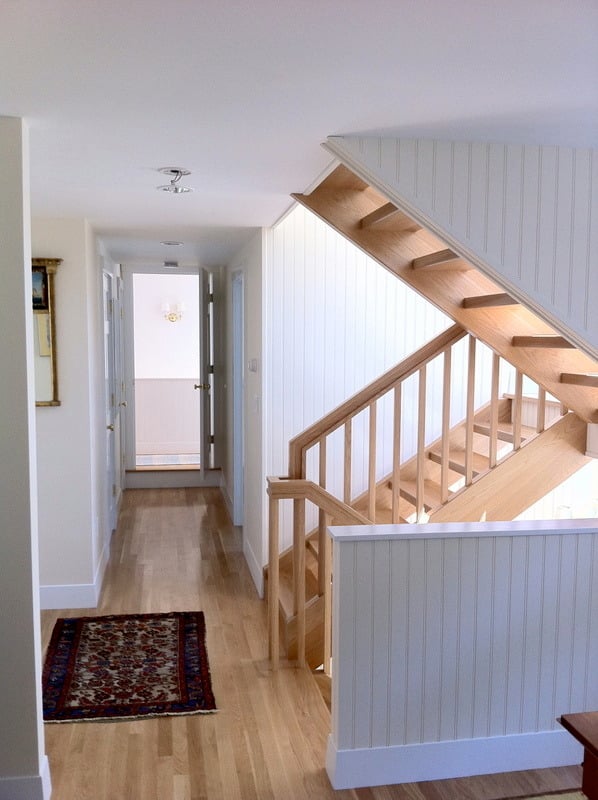 Wooden staircase renovation by At Design Remodel in Cataumet, Cape Cod home