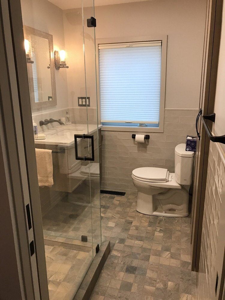 Bathroom renovation in Centerville showcasing glass shower and sleek fixtures, At Design Remodel, Mashpee