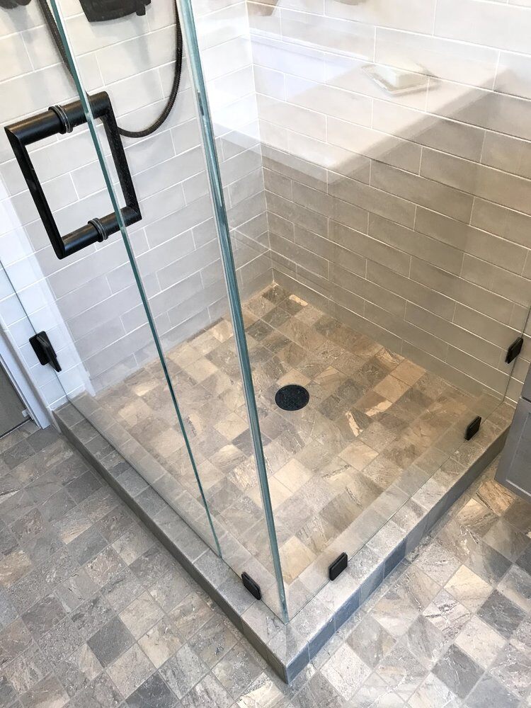 Centerville bathroom renovation featuring tiled shower floor by At Design Remodel, Mashpee