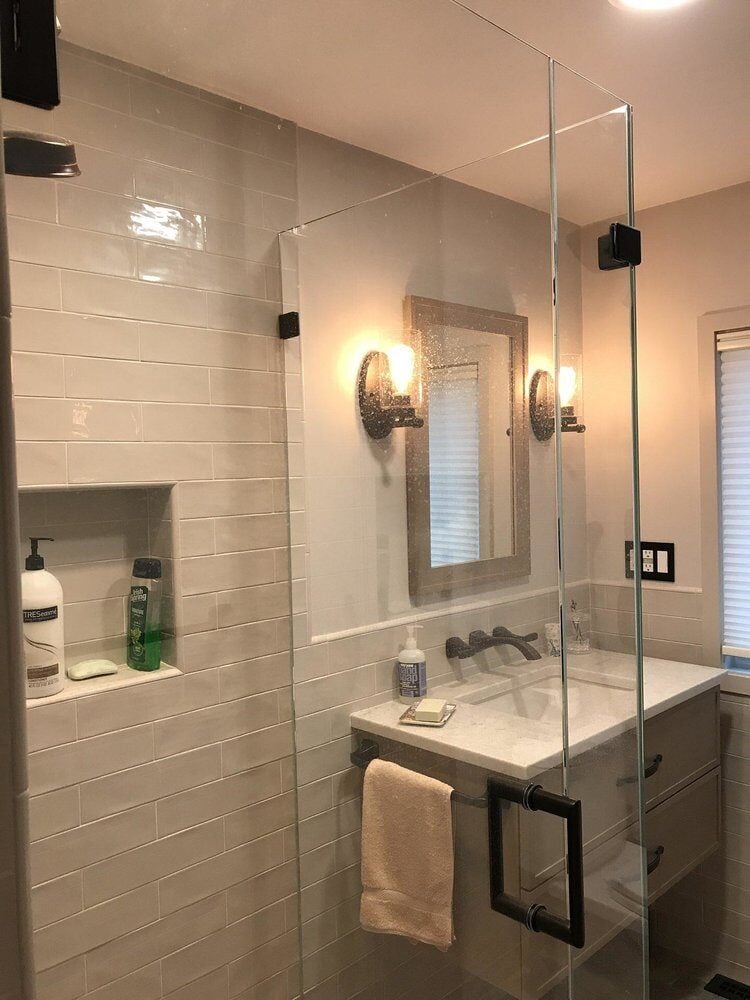 Updated bathroom shower with built-in shelving in Centerville remodel by At Design Remodel, Mashpee