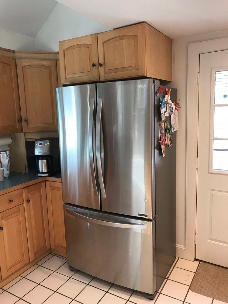 Stainless steel fridge in a remodeled kitchen with oak cabinets, Centerville Kitchen Remodel by At Design Remodel, Mashpee