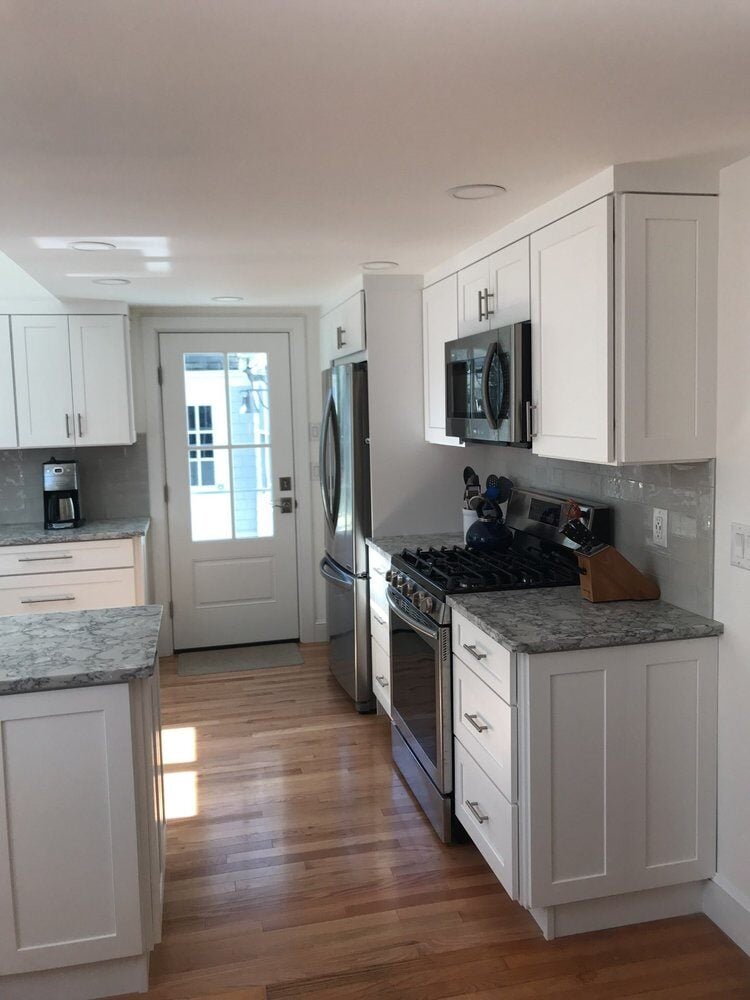 White cabinet kitchen with granite countertops and stainless steel appliances, Centerville Kitchen Remodel by At Design Remodel, Ma