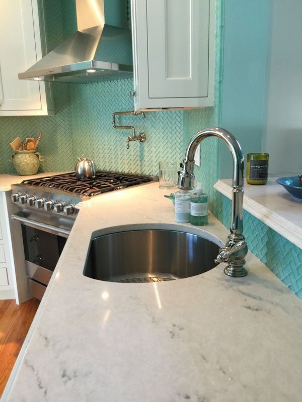 Seagreen tile backsplash in a custom kitchen remodel by At Design Remodel in Mashpee