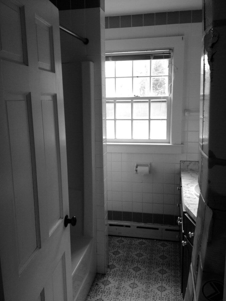 Bathroom window and tub enclosure in Pin Oak Bath, remodeled by At Design Remodel, Mashpee