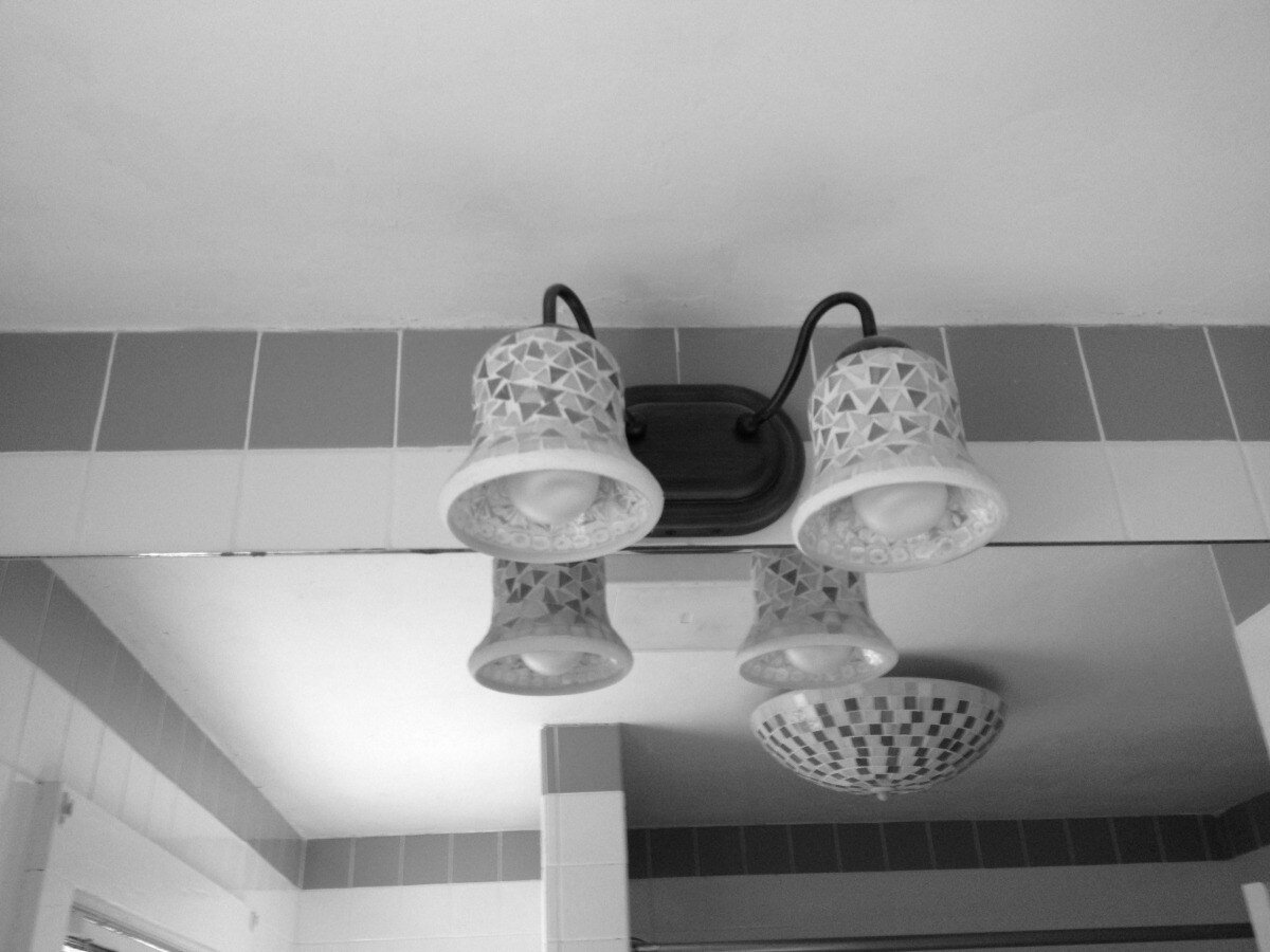Decorative lighting fixture in Pin Oak Bath bathroom renovation by At Design Remodel