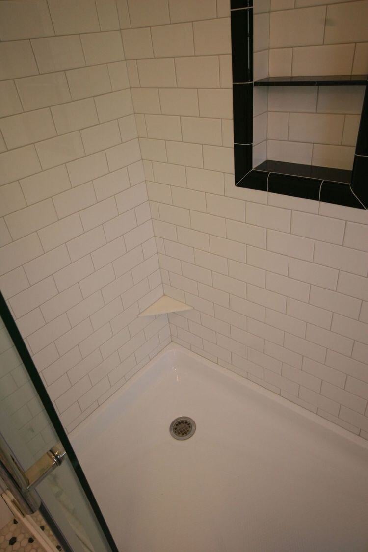 Shower drain and tile pattern in Pin Oak Bath renovation by At Design Remodel, Mashpee