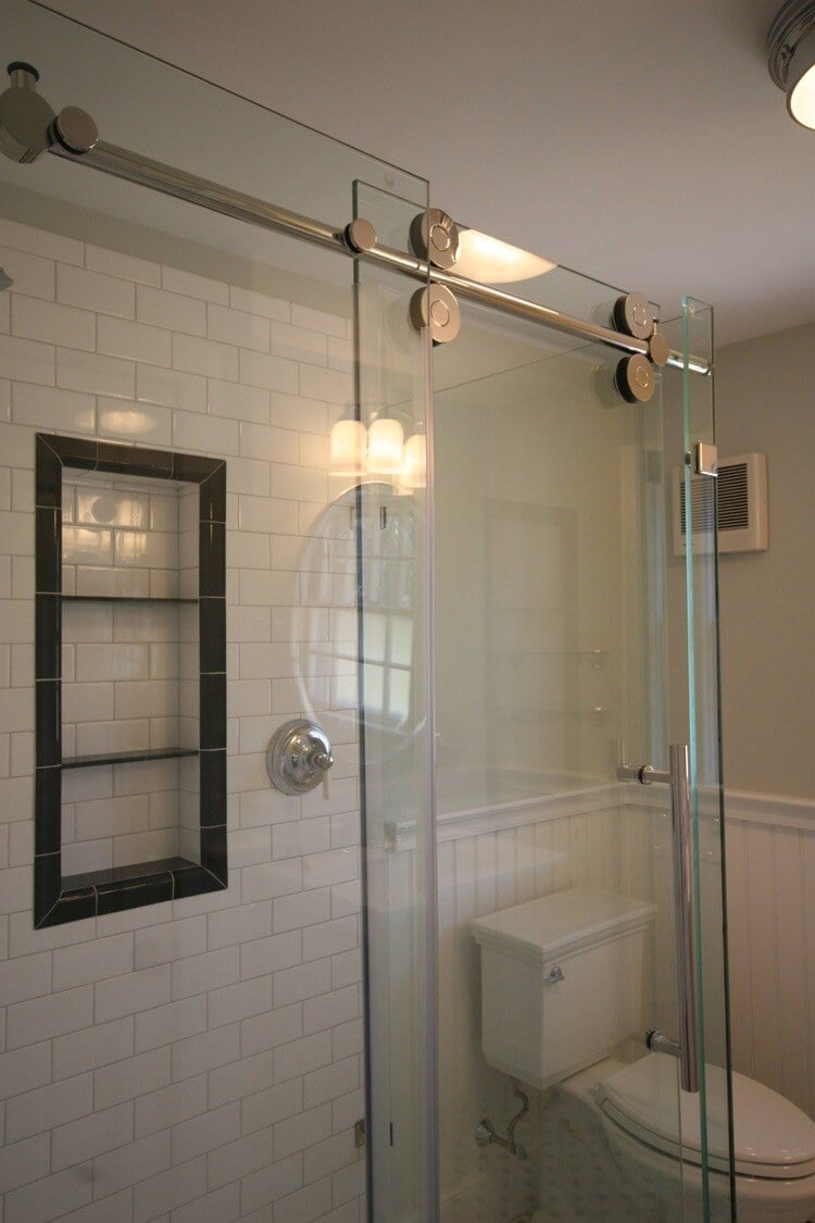 Toilet and glass-enclosed shower installation in Pin Oak Bath, Mashpee