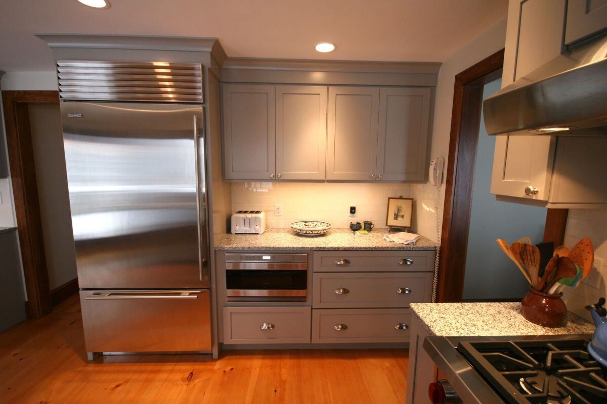 Custom cabinetry and modern appliances in a remodeled kitchen in Falmouth