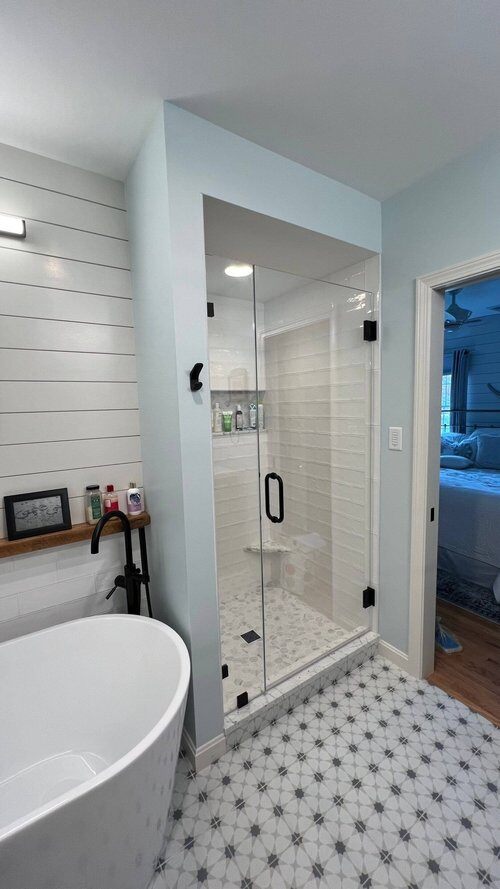 Master bathroom remodel with glass-enclosed shower in custom home by At Design Remodel in Dennis, MA