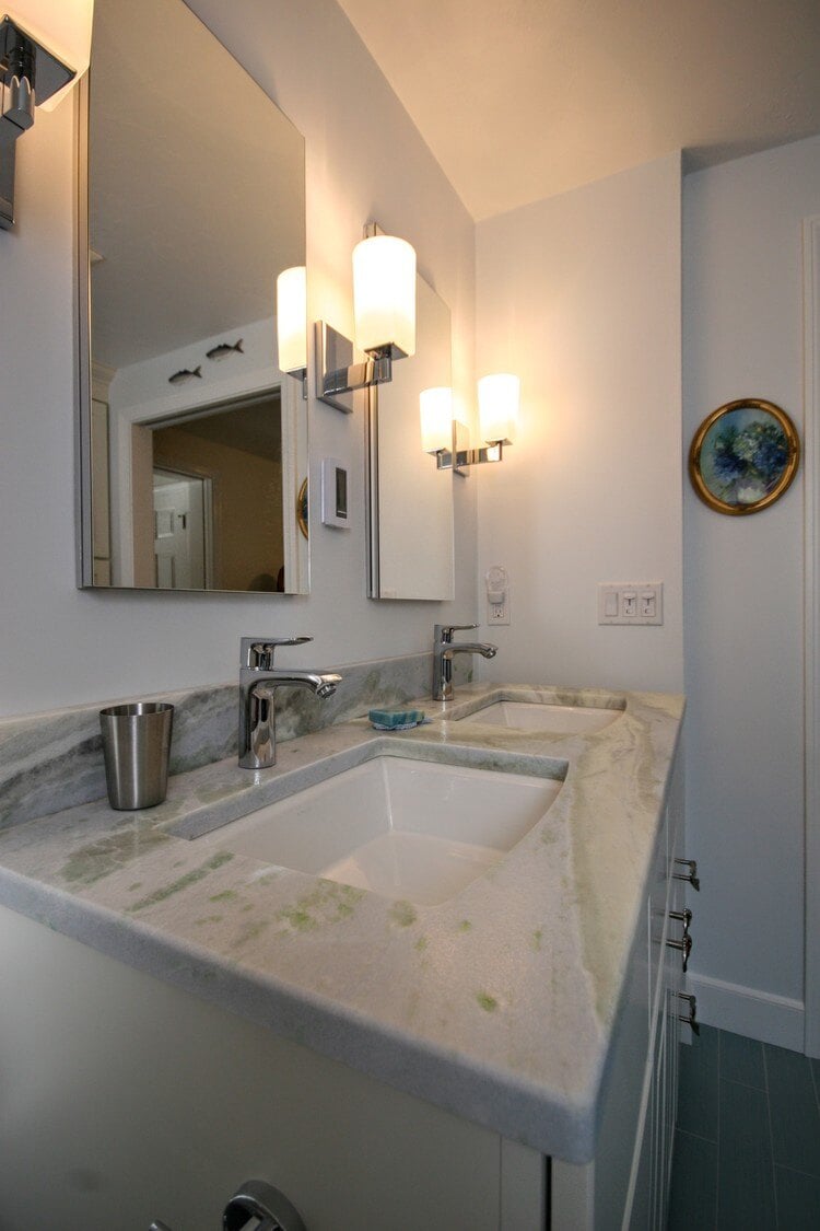 Dual sink vanity with marble countertops in a Mashpee bathroom renovation by At Design Remodel