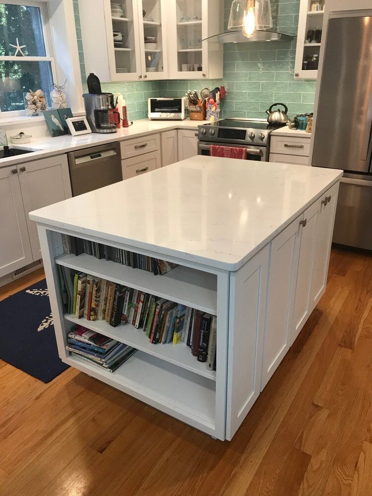 Modern kitchen island with built-in shelves in Mashpee kitchen remodel by At Design Remodel