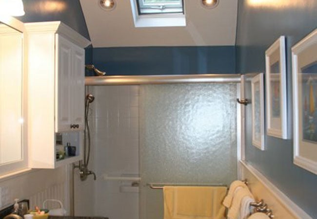 Skylight and recessed lighting in finished New Seabury bathroom remodel by At Design Remodel, Mashpee