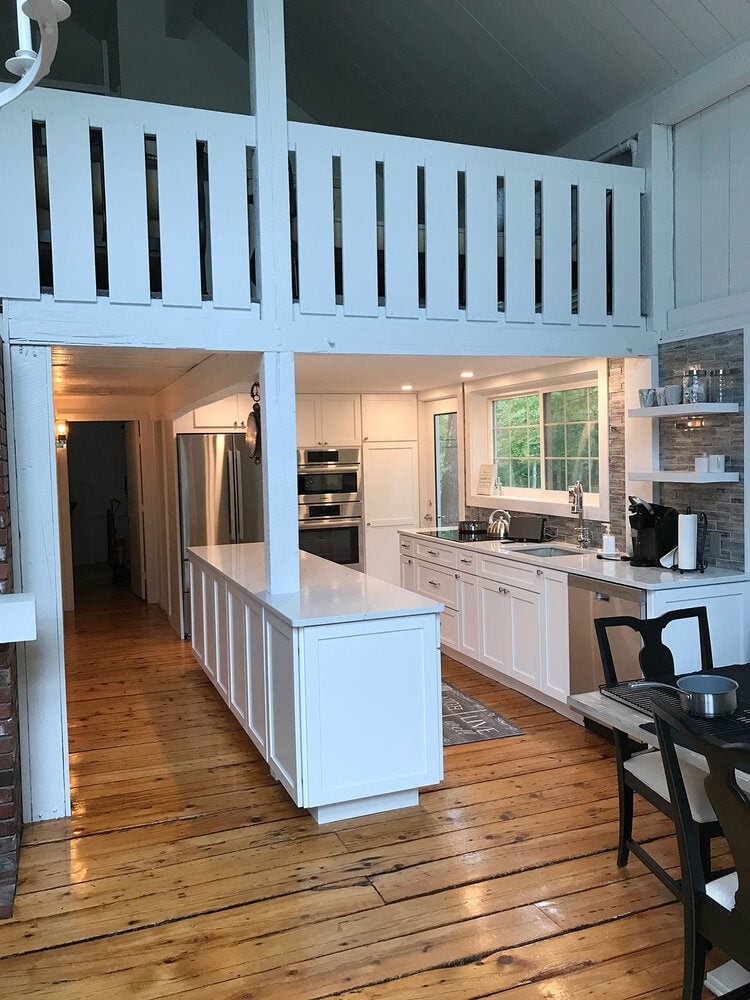 White cabinetry and stainless steel appliances in a remodeled kitchen on Greensward Road, New Seabury