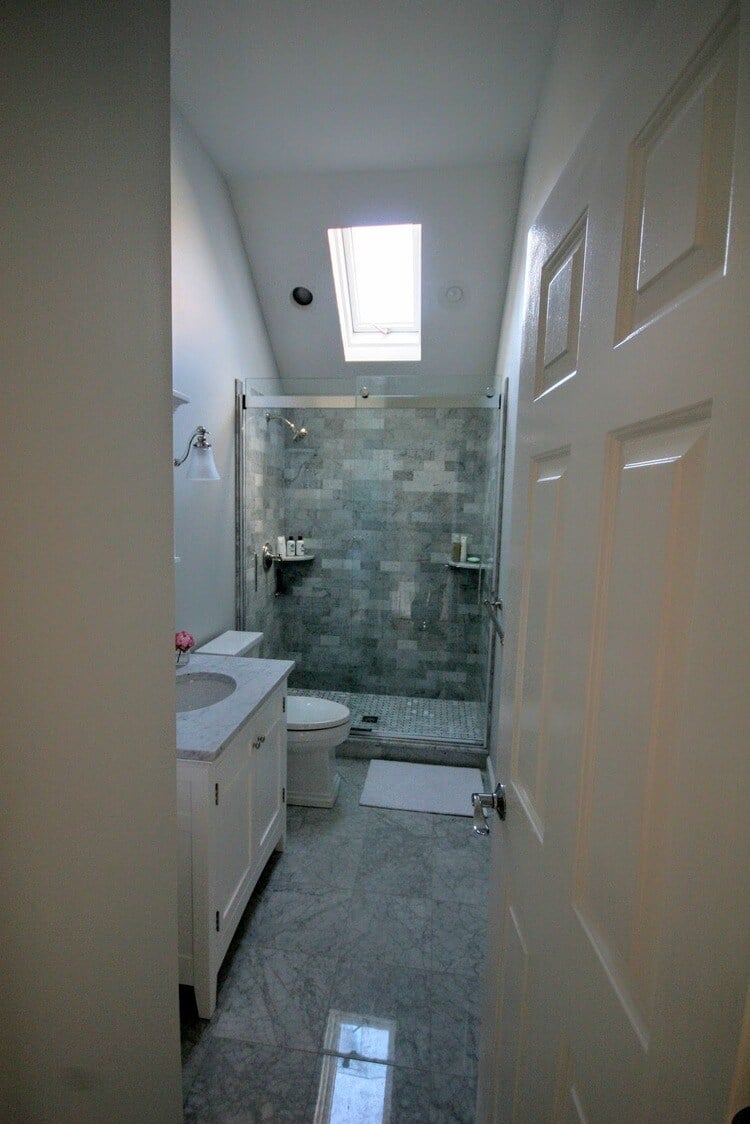 Marble countertop and subway tile backsplash in New Seabury Mews condo kitchen, remodeled by At Design Remodel