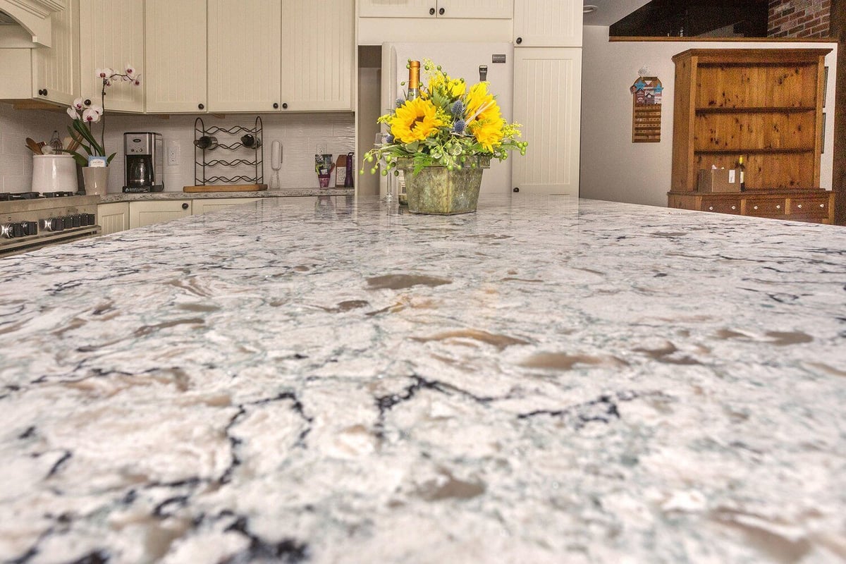 Granite kitchen island with sunflowers, part of a North Falmouth kitchen design project