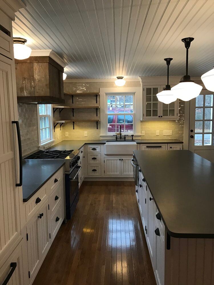 Overhead view of a modern kitchen layout with island and farmhouse sink, remodeled in Falmouth by At Design Remodel