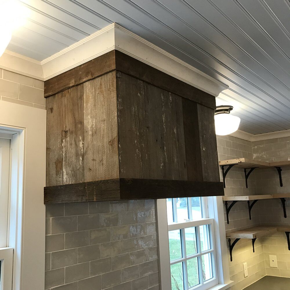 Rustic wood vent hood installed in a remodeled kitchen in Falmouth by At Design Remodel, Mashpee