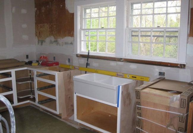 Installation of new sink and cabinets in a kitchen remodel in West Falmouth by At Design Remodel