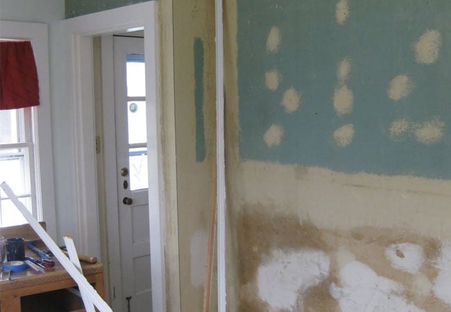 Patchwork on kitchen walls as part of a West Falmouth home remodel by At Design Remodel, Mashpee