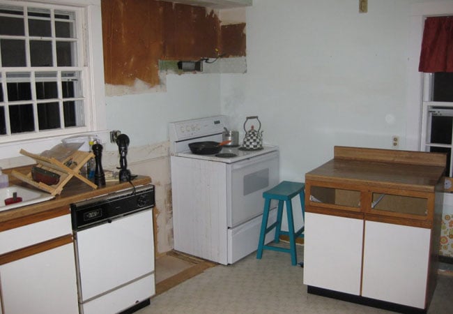 Unfinished kitchen with appliances in the middle of a West Falmouth home remodel by At Design Remodel