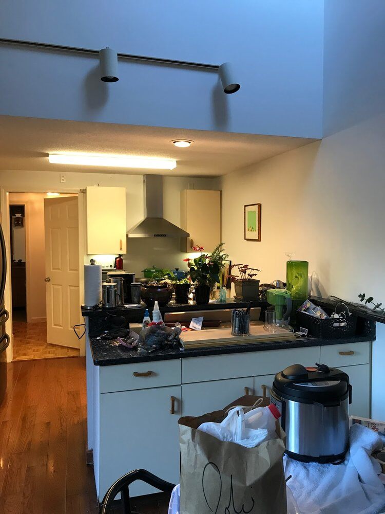 Cluttered kitchen counter and appliances before remodeling in Yarmouthport by At Design Remodel, Mashpee