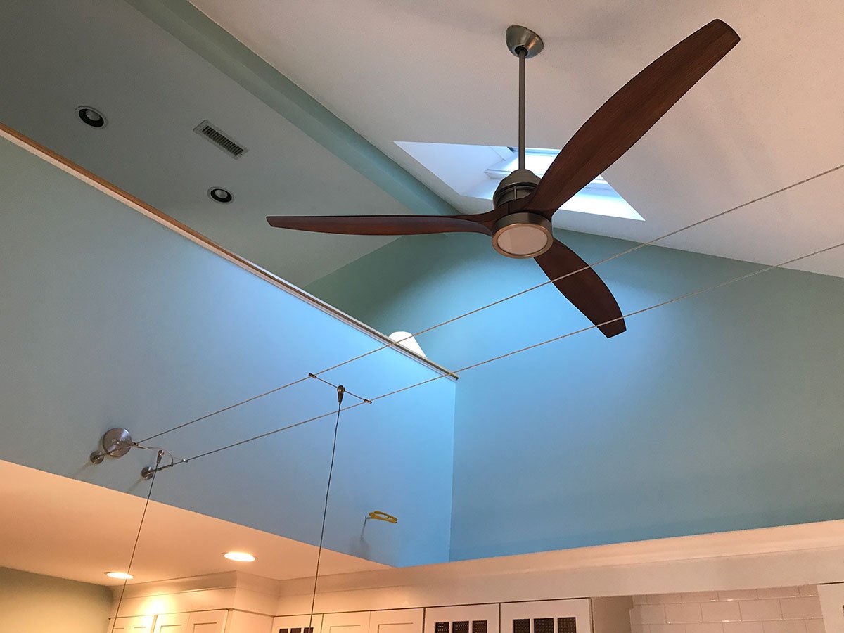 Stylish ceiling fan with skylight in Yarmouthport kitchen by At Design Remodel, Mashpee