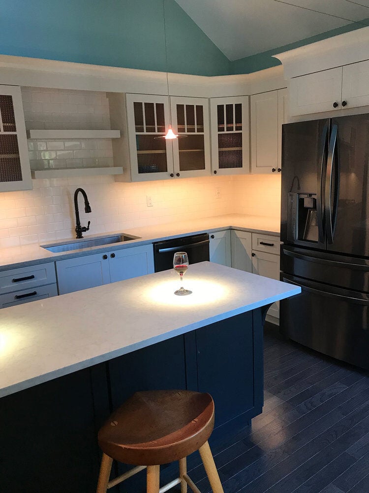 Stylish kitchen island centerpiece in a Yarmouthport remodel by At Design Remodel, Mashpee