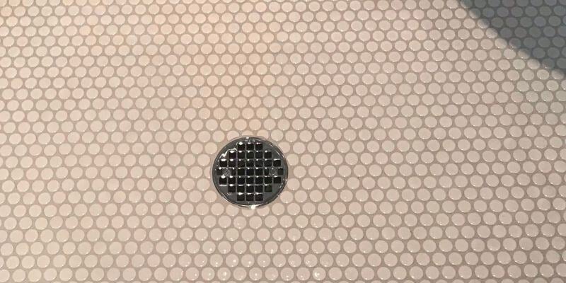 custom tile shower with metal drain cape cod